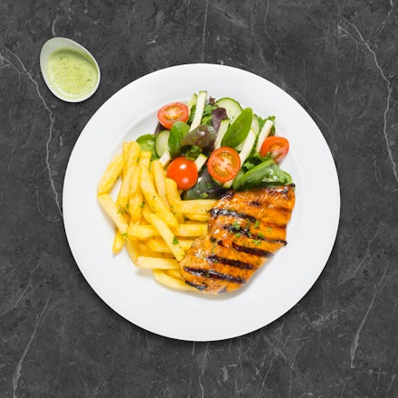 Grilled chicken steak with spinach and cream sauce