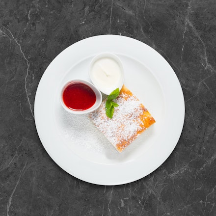 Cottage cheese casserole with sour cream and mashed strawberries