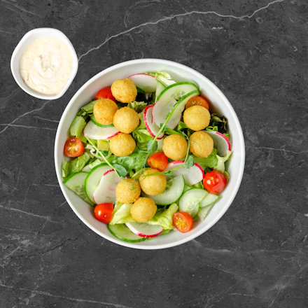 Salad with fried potato croquettes