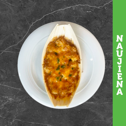 Baked dumplings with meat in cheddar sauce